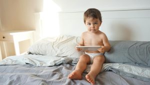baby with tablet